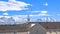 Panorama Homes in the valley against lake snowy mountain and cloudy sky on a sunny day