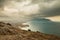 panorama, horizontal view of Crimean mountains with rocky coastline, Black sea before the rain, storm