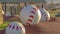 Panorama Huge baseball decoration on top of brown mounds at a playground