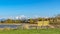 Panorama Idyllic view of a lake with homes near the shore and mountain in the distance