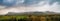 Panorama image of Benbulben flattop mountain in county Sligo, Ireland, Dramatic sky, top covered with snow. Popular tourists