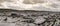 Panorama image of Burren landscape, county Clare, Ireland, Rough stone terrain, Cloudy dramatic sky