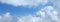 Panorama image, fluffy white cloud moving above dream sky