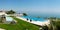 Panorama of infinity swimming pool by beach
