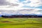 Panorama of isolated house in front of mountains in Switzerland