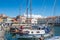 Panorama of Izola old fishing harbor with traditional fishing boats and old medieval town
