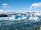 Panorama of Jokulsarlon glacier and icebergs floating in the lagoon