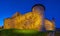 Panorama of Kamianets-Podilskyi Castle ramparts at night, Ukraine