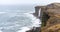 Panorama of KetubjÃ¶rg bird cliffs and waterfall in the Skagi peninsula in Iceland.