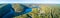 Panorama of Lake Nepean and forested hills.