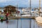 Panorama of the lake with private yachts and boats at cloudy sunset.