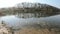 Panorama of the lake shore with dead fish
