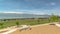 Panorama Lake and snow capped mountain viewed fron a park with colorful playground set