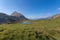 Panorama of Lake Valparola nestled in the middle of meadows, Dolomites, Italy