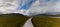 Panorama landscape of the Claggan Mountain Coastal Trail bog and boardwalk with the Nephir mountain range in the background