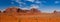 Panorama landscape - Iconic peaks of rock formations in the Navajo Park of Monument Valley