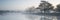 Panorama landscape of lake in mist with sun glow at sunrise