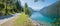 Panorama landscape pictorial turquoise lake Achensee in summer, lakeside bike way