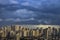 Panorama landscape scenery of buildings and skyscrapers in business center of Sao Paulo city with rainy cloud over city.