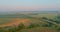 Panorama landscape view in sunrise over the meadow across high speed highway in the morning fog in the thick fog natural
