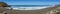 Panorama of large black sand beach, Pacific Ocean coastline, Mori Point, Pacifica, California