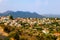 Panorama of Lefkara, traditional Cypriot village with red rooftop houses and mountains in the background, Larnaca district, Cyprus