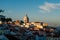 A panorama of Lisbon city at sunset buildings in the shadow golden hour last rays of sun on the National Pantheon - Lisbon,