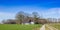 Panorama of a little white farm in nature area Drents-Friese Wold