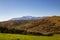 panorama of the Majella mountain with worked agricultural fields. Autumn in Italy