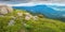 Panorama with massive rocks on a grassy meadow