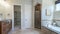 Panorama Master bathroom interior with antiqued limestone tiles