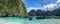 Panorama of Maya Bay with colourful longtailboats