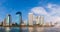 panorama modern building under the blue sky and cloudy with reflection on lake, image concept two-tone warm and cool