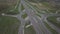 Panorama of the motorway with a bird`s eye view. Transport artery of the country. The movement of vehicles on the highway. Landsca