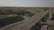 Panorama of the motorway with a bird`s eye view. Transport artery of the country. The movement of vehicles on the highway. Landsca