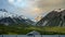 Panorama Mount Cook in the evening, fast-moving clouds and vanilla skies in time-lapse photography