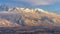 Panorama Mount Timpanogos over homes with snow at winter and illuminated by golden sunset