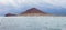 Panorama of mountain El Medano and group of windsurfers rides in