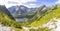 Panorama of mountain lake of glacial Popradske Pleso 1494m in High Tatras mountains, Slovakia. Picturesque view during the