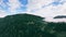 Panorama of mountain landscape. Valley filled with fog and wooded mountains. 360