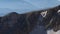 Panorama of a mountain peak with remnants of snow. National Nature Reserve