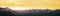 Panorama of Mountain peaks landscape at sunset