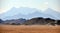Panorama of a mountain range in the Arabian desert. An example of the sultry tonal perspective of the Egyptian open spaces. In the