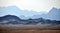 Panorama of a mountain range in the Arabian desert. An example of the sultry tonal perspective of the Egyptian open spaces. In the