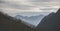 Panorama of the mountain range and slopes of the mountains in the early morning in the mountains of the Caucasus