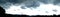 Panorama of Mountain Silhouette and Clouds