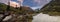 Panorama of a mountain stream, glacier and rocks
