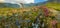 Panorama of a mountain stream, glacier and rocks