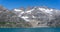 Panorama of mountainous glaciers and meltwater waterfalls in Prince Christian Sound, South Greenland