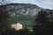 Panorama of the mountains in Baile Herculane with a focus on a high rise tower, socialist architecture. Baile Herculane is a